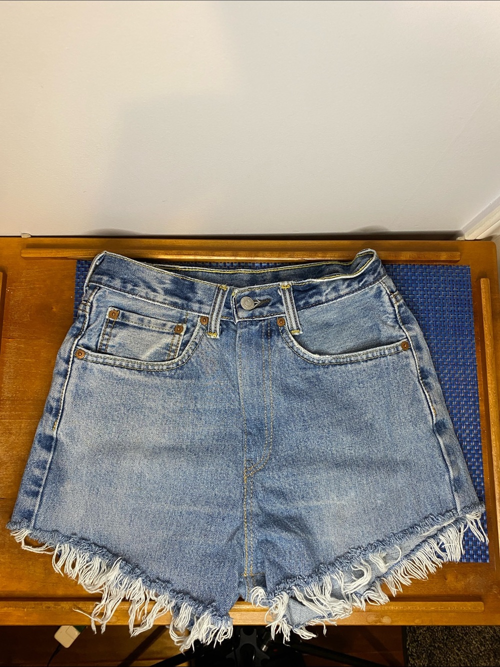Levi’s denim cutoffs, 550s, repair on belt loop, 2” inseam